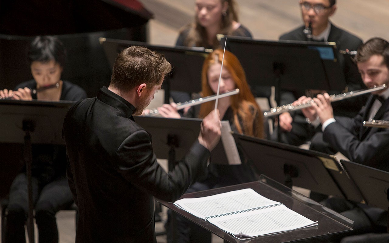 Kevin Michael Holzman conducting the CCM Wind Symphony